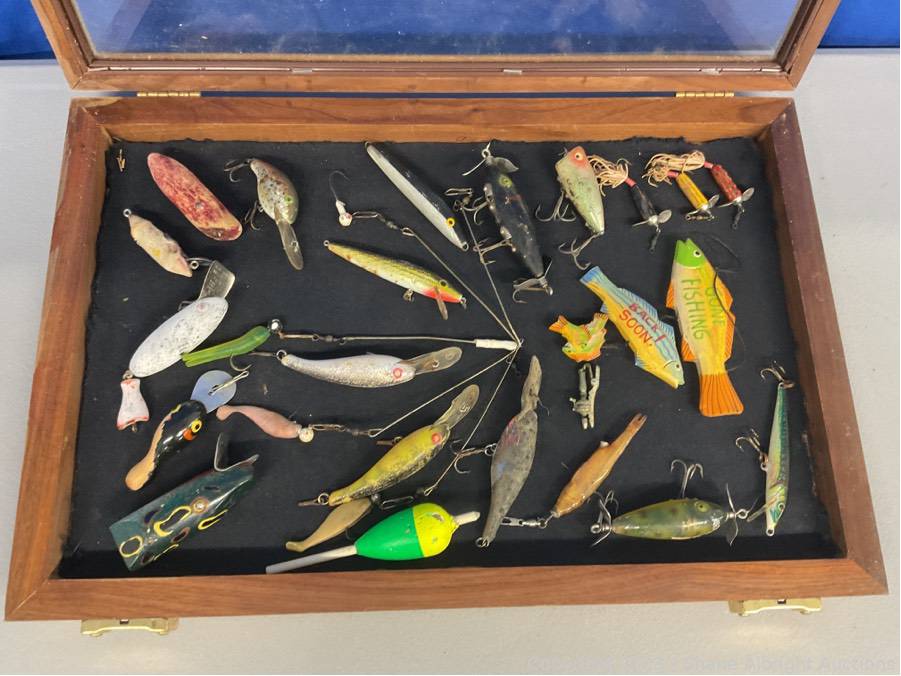Wooden fishing lures in display case Auction | Shane Albright Auctions